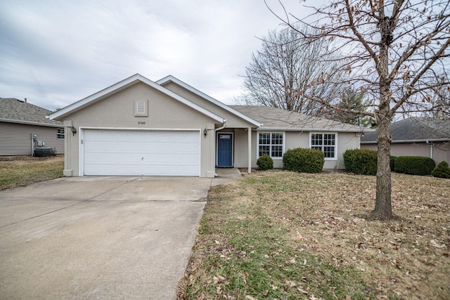 ranch-style home featuring a garage