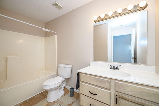 full bathroom featuring shower / washtub combination, tile patterned flooring, vanity, toilet, and a textured ceiling