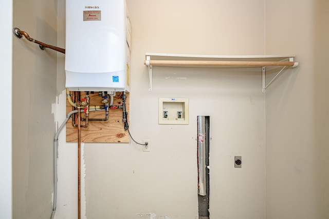 laundry area featuring electric dryer hookup, washer hookup, and tankless water heater