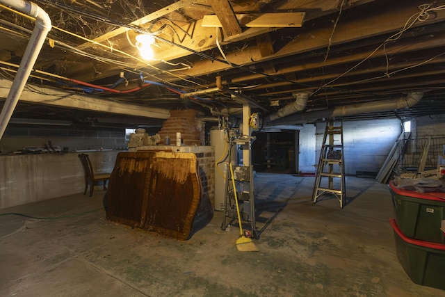 basement featuring gas water heater