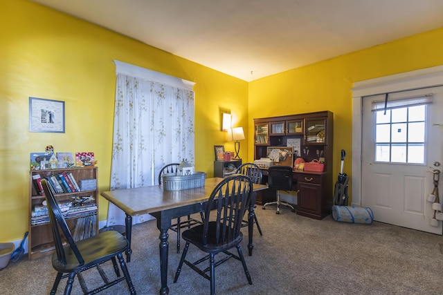 view of carpeted dining area