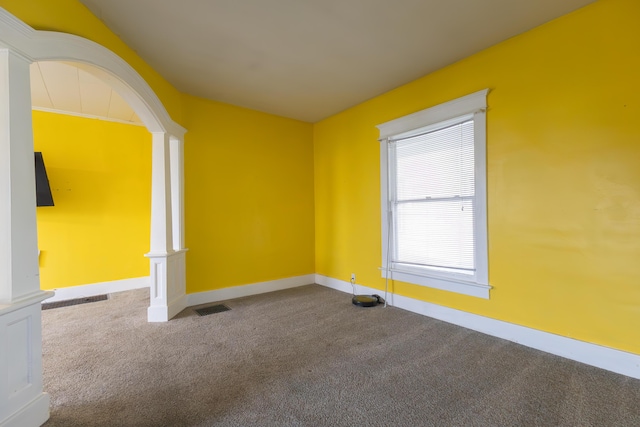486 E Rollins St, Moberly, MO 65270 - carpeted spare room with decorative columns and baseboards