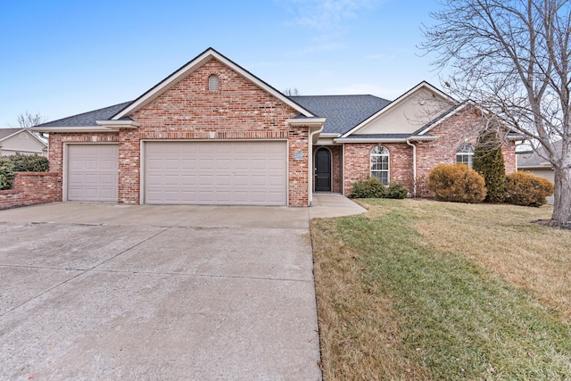 front facade featuring a garage and a front yard