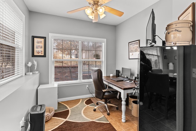 tiled office space with ceiling fan