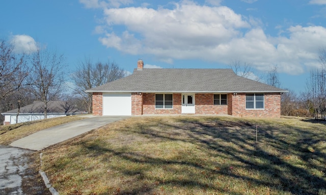 ranch-style home with a front lawn, brick siding, and driveway