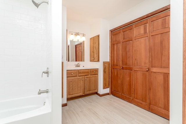 full bathroom featuring vanity, tub / shower combination, and baseboards