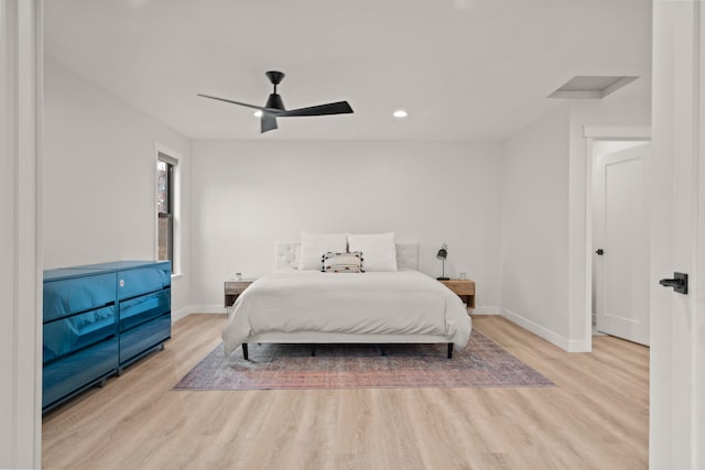 bedroom featuring recessed lighting, attic access, ceiling fan, wood finished floors, and baseboards