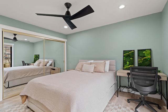 bedroom featuring a closet, a ceiling fan, wood finished floors, and recessed lighting