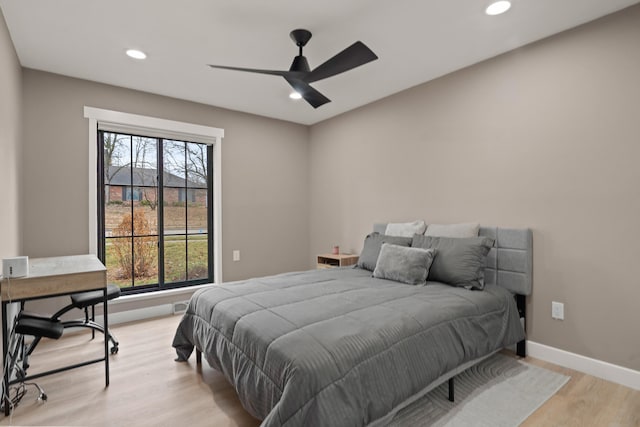 bedroom featuring baseboards, ceiling fan, recessed lighting, and light wood-style floors