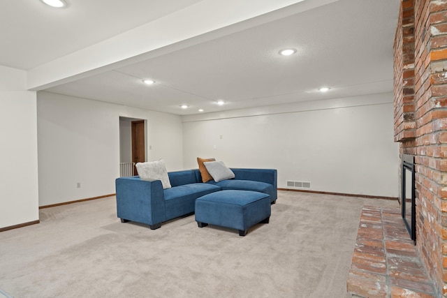 carpeted living area featuring recessed lighting, a brick fireplace, visible vents, and baseboards