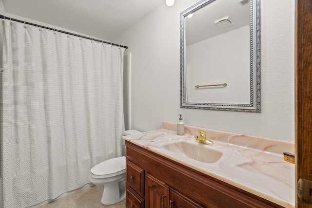 bathroom featuring toilet, curtained shower, and vanity