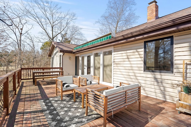 wooden deck with an outdoor hangout area