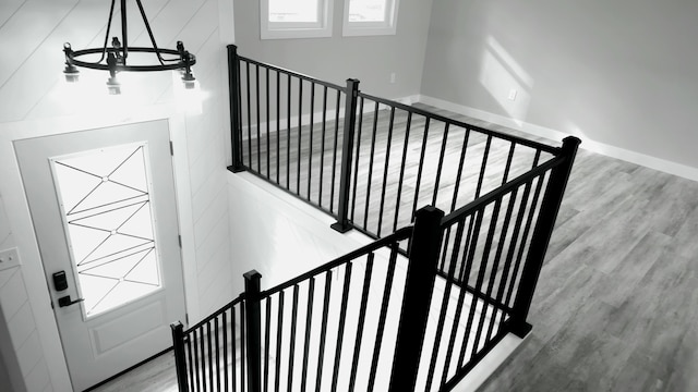 stairway featuring hardwood / wood-style flooring