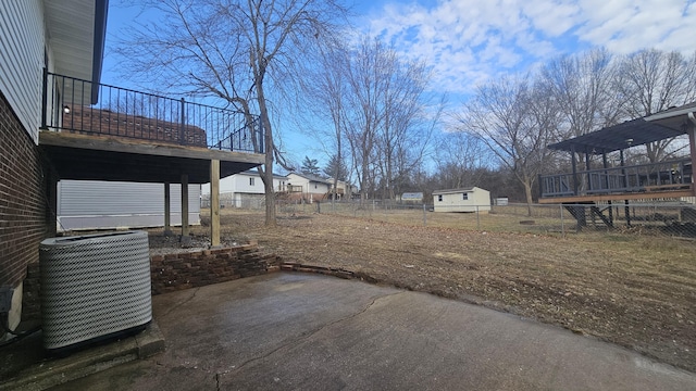 view of yard featuring cooling unit and a patio area