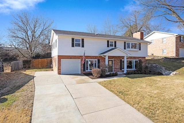 view of front of house featuring a garage and a front yard