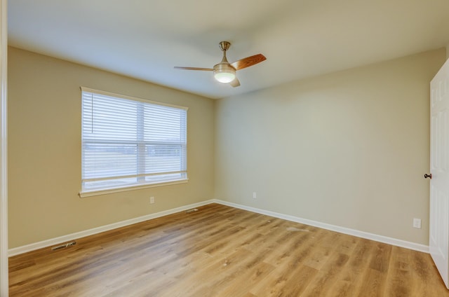 unfurnished room featuring ceiling fan and light hardwood / wood-style flooring