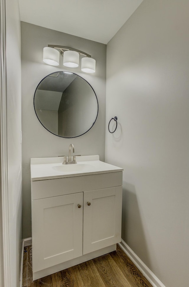 bathroom featuring hardwood / wood-style flooring and vanity