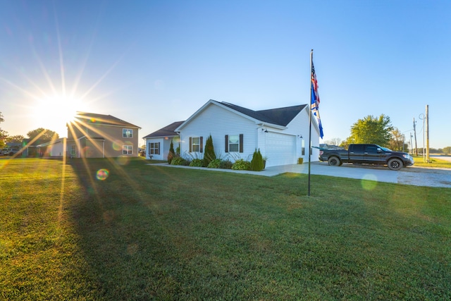 view of side of home with a yard and a garage