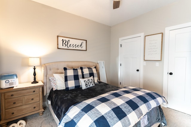 carpeted bedroom featuring ceiling fan