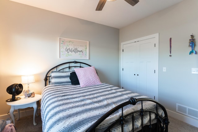 bedroom with ceiling fan, carpet floors, and a closet