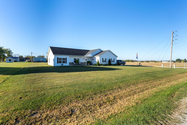 single story home with a front lawn