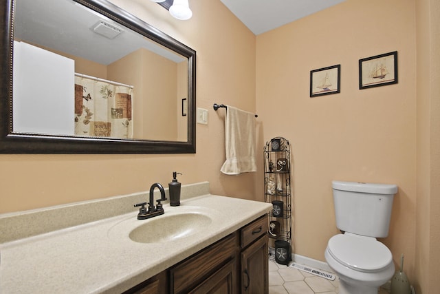 bathroom with baseboards, visible vents, vanity, and toilet