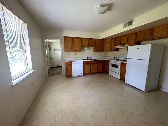 kitchen featuring sink and white appliances