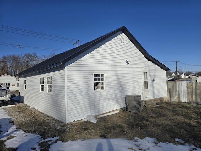 view of home's exterior with central AC unit