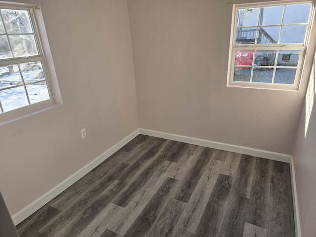 empty room featuring dark hardwood / wood-style floors