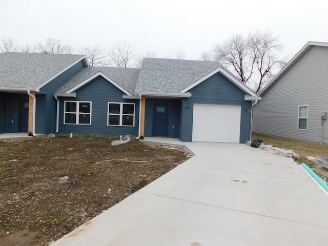 single story home featuring a garage