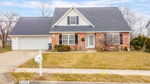 view of front of property with a garage and a front yard