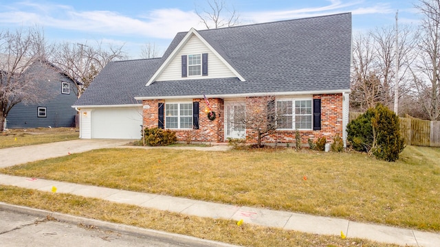 view of front of house with a garage and a front lawn