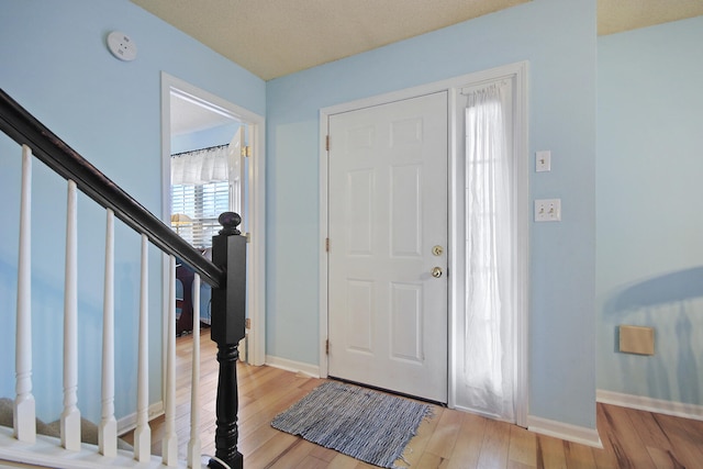 foyer with light hardwood / wood-style floors