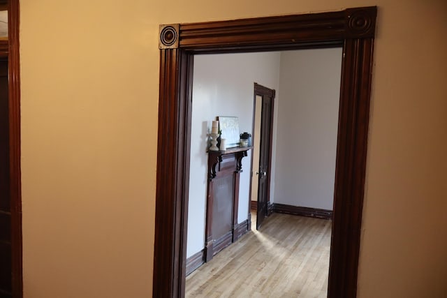 hallway with light wood-type flooring