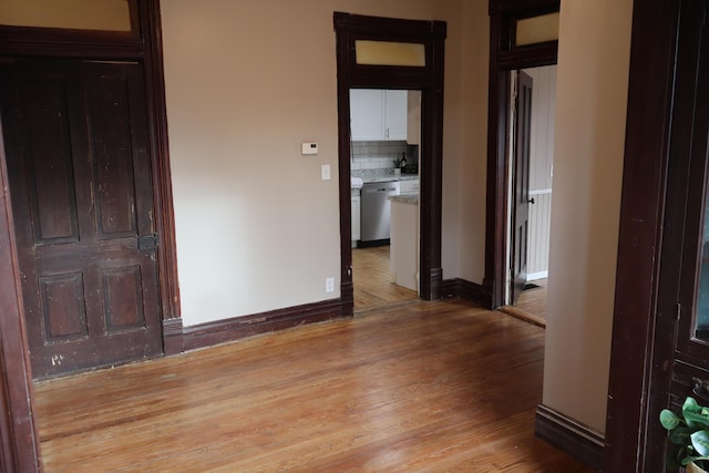 spare room featuring light hardwood / wood-style flooring