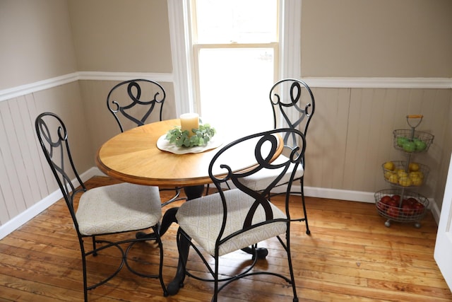 dining area with hardwood / wood-style floors