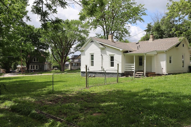 402 W Spring St, Fayette, MO 65248 - view of front of house featuring a chimney and a shingled roof