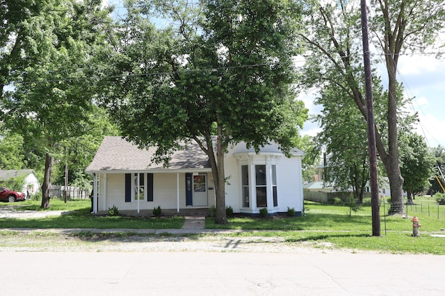 402 W Spring St, Fayette, MO 65248 - obstructed view of property with covered porch and roof with shingles