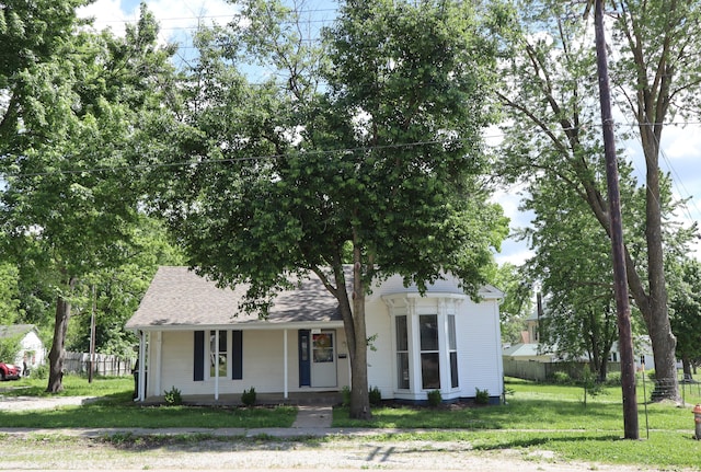 402 W Spring St, Fayette, MO 65248 - obstructed view of property featuring a porch and roof with shingles