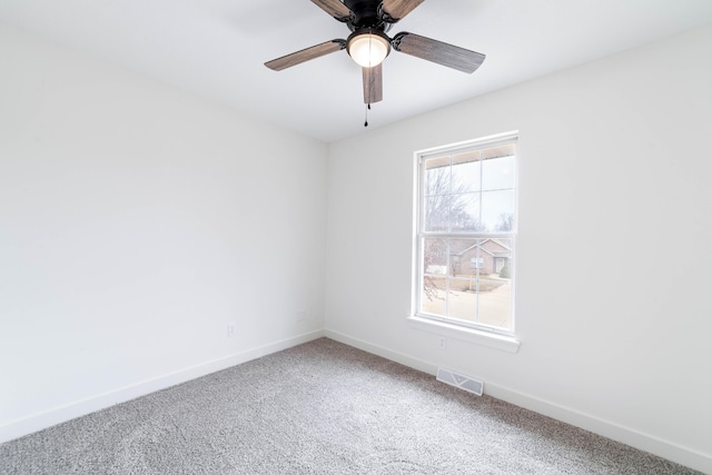 empty room with carpet and ceiling fan