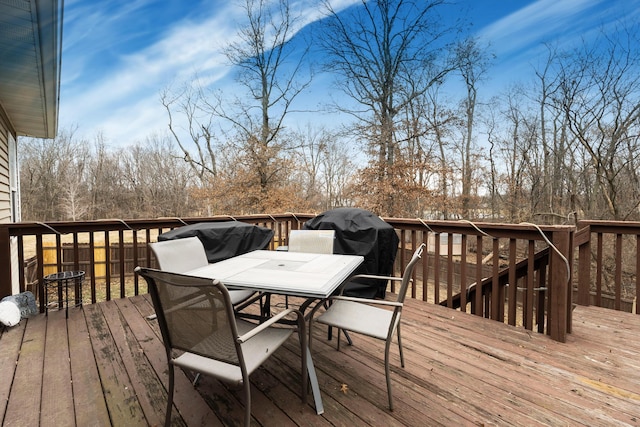 wooden terrace with area for grilling