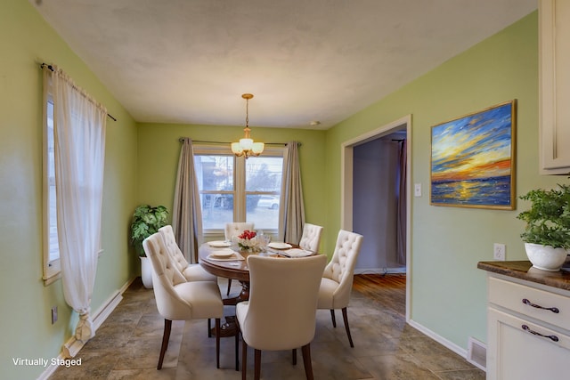 dining room featuring an inviting chandelier