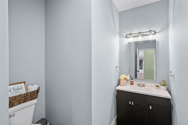 bathroom with toilet and vanity