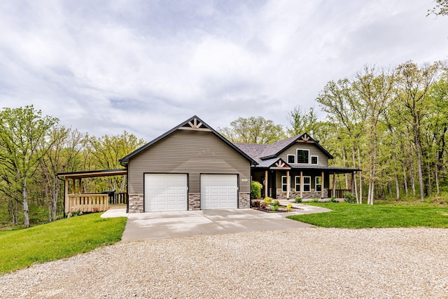 4503 E Mcgee Rd, Columbia, MO 65202 - view of front of home with an attached garage, stone siding, a front yard, covered porch, and driveway