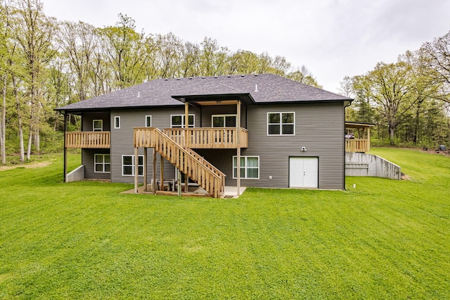 4503 E Mcgee Rd, Columbia, MO 65202 - back of house featuring a lawn, stairway, a wooden deck, and a shingled roof