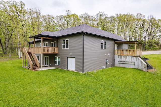 4503 E Mcgee Rd, Columbia, MO 65202 - back of house with a deck, a yard, a patio, a shingled roof, and stairs