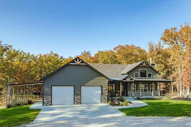 4503 E Mcgee Rd, Columbia, MO 65202 - craftsman house featuring a garage, a front lawn, stone siding, concrete driveway, and a porch