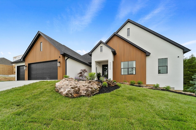 modern inspired farmhouse with a garage, driveway, and a front yard