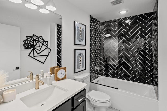 bathroom with toilet, visible vents, combined bath / shower with glass door, and vanity