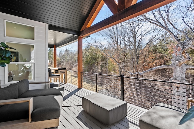 wooden terrace featuring an outdoor living space